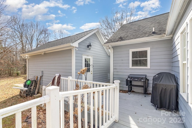 wooden deck featuring area for grilling