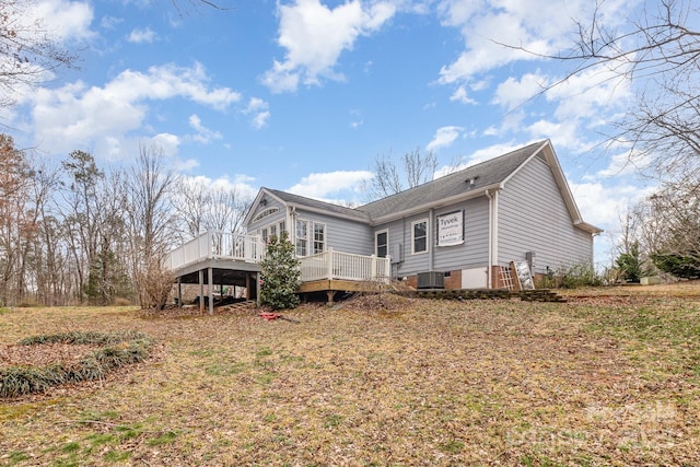 exterior space with crawl space, a wooden deck, and central air condition unit