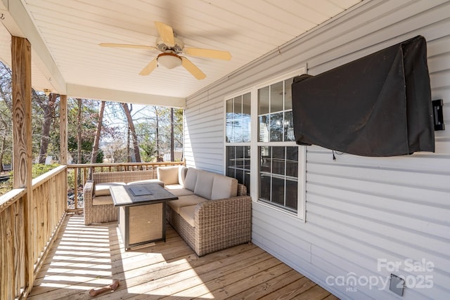 deck featuring a ceiling fan and outdoor lounge area