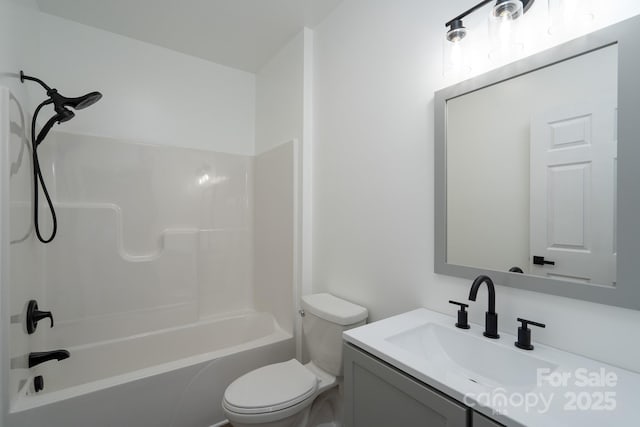 bathroom with shower / washtub combination, vanity, and toilet