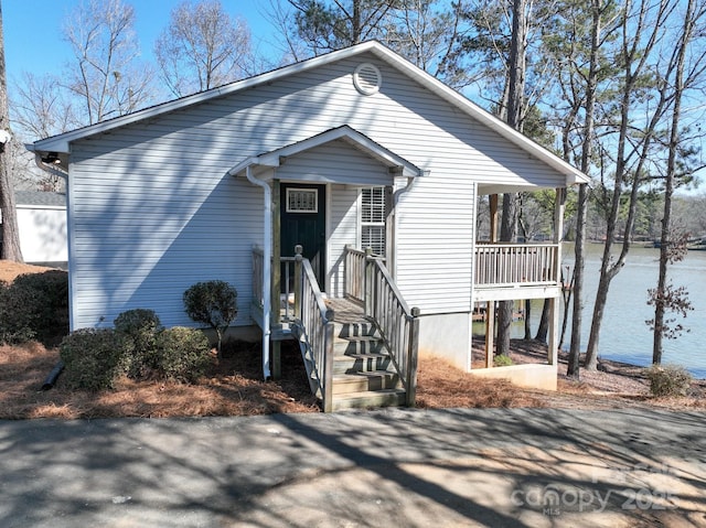 view of front of home with a water view