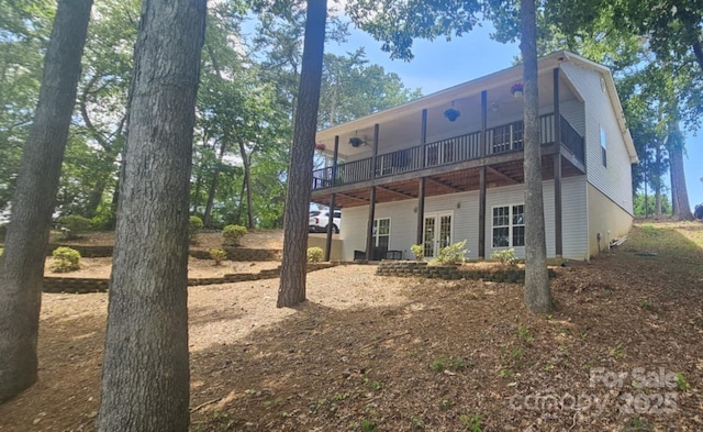 604 Fairway Shores Rd, Mount Gilead, NC 27306 - rear view of house with french doors and a wooden deck