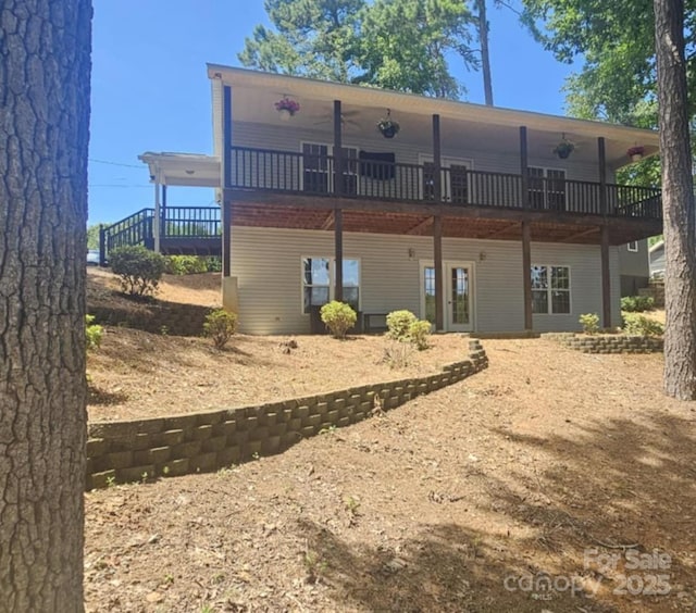 604 Fairway Shores Rd, Mount Gilead, NC 27306 - rear view of property featuring a wooden deck