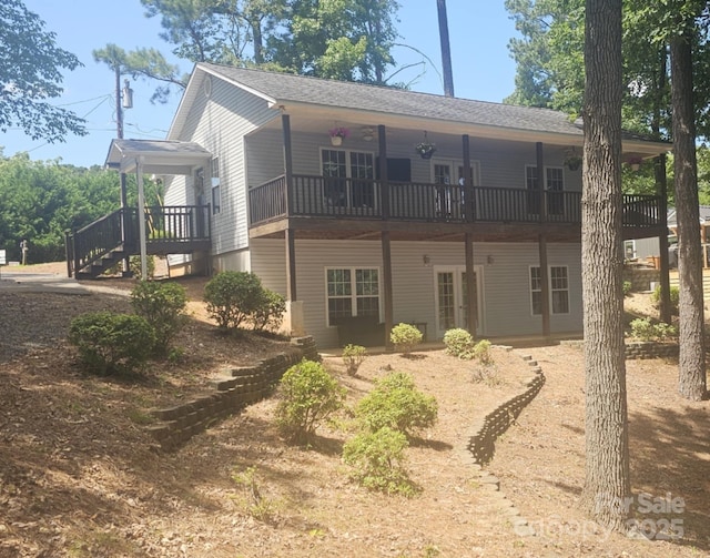 604 Fairway Shores Rd, Mount Gilead, NC 27306 - rear view of house featuring french doors, a deck, and roof with shingles