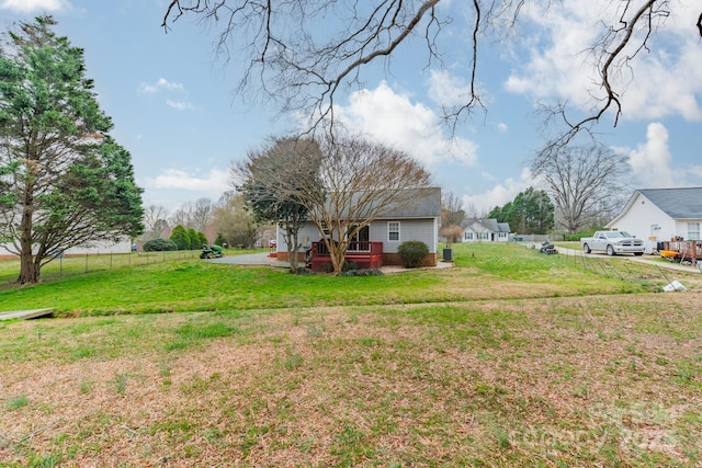 view of yard featuring a deck and fence