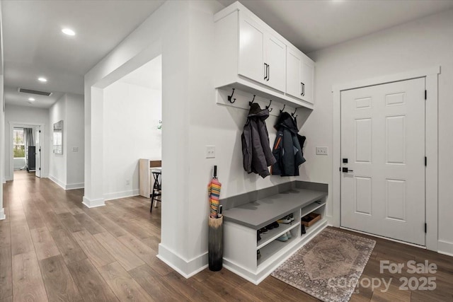 mudroom featuring recessed lighting, visible vents, baseboards, and wood finished floors