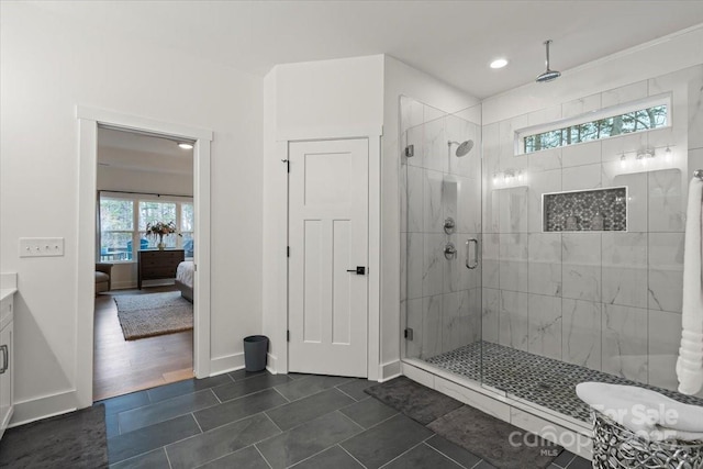 ensuite bathroom with plenty of natural light, a shower stall, and ensuite bathroom