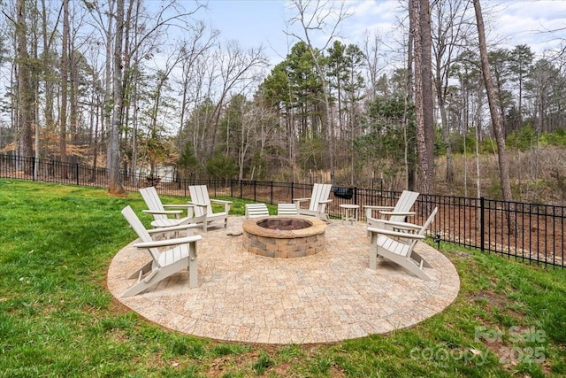 view of patio / terrace featuring a fire pit and fence