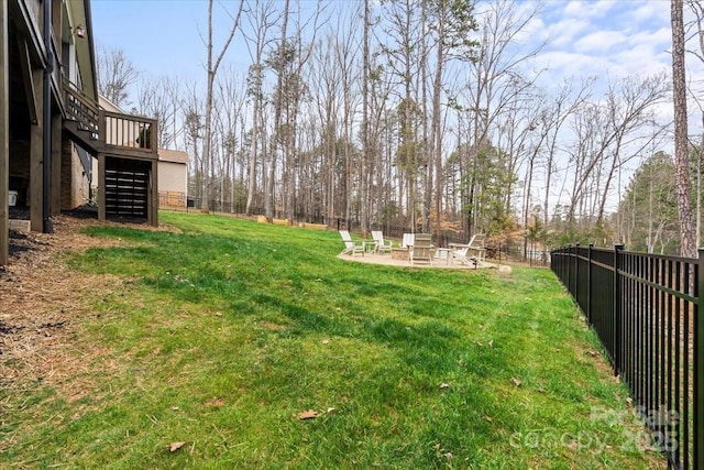 view of yard featuring a patio, a fenced backyard, and stairs