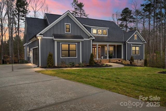 modern inspired farmhouse featuring board and batten siding, a porch, concrete driveway, a garage, and crawl space