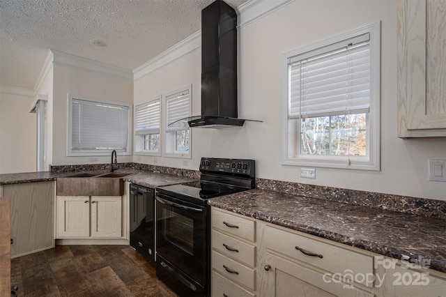 kitchen featuring dark wood finished floors, crown molding, a sink, wall chimney range hood, and black appliances