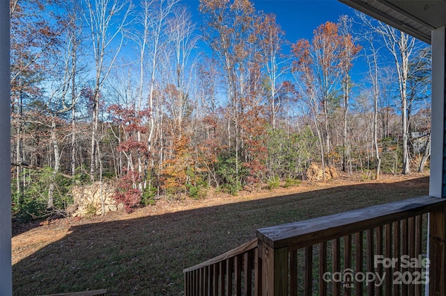 view of yard with a wooded view