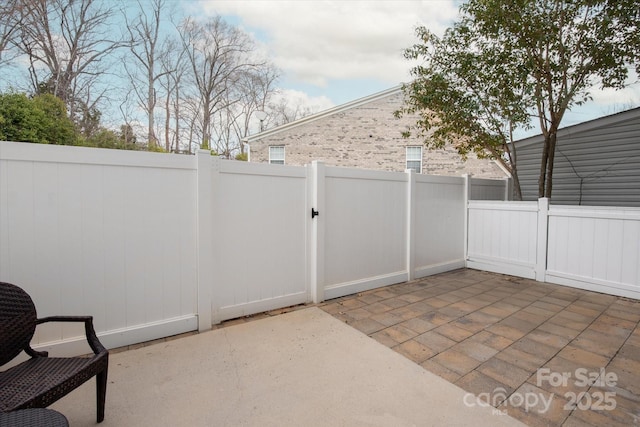 view of patio / terrace with fence