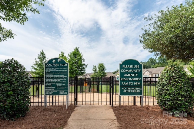 view of gate featuring fence