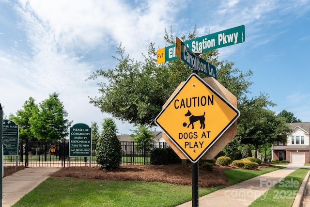 community sign with fence