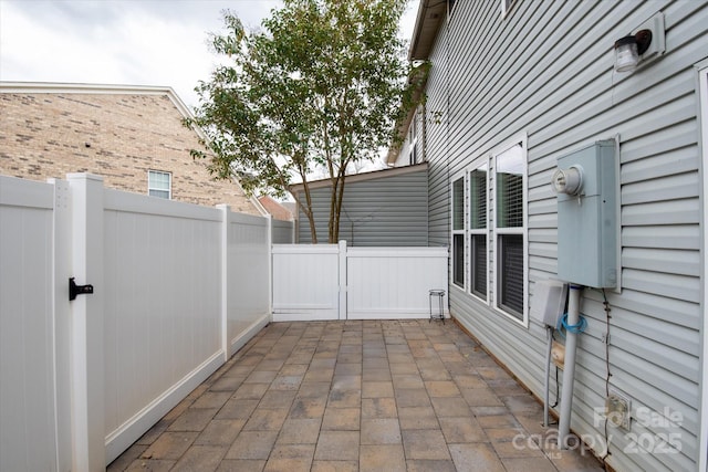 view of patio / terrace featuring fence