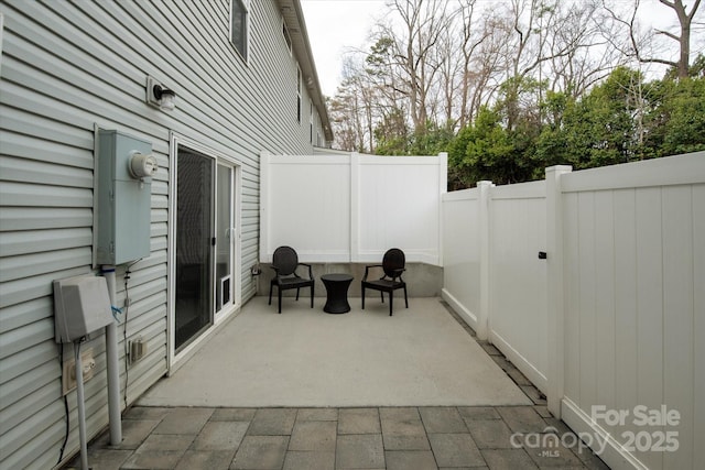 view of patio with fence