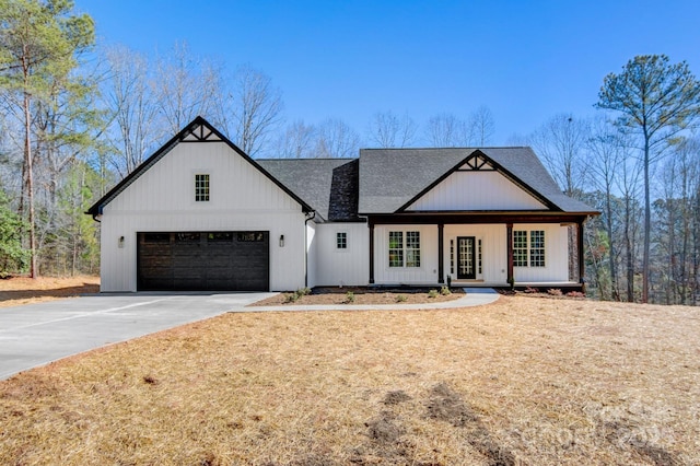 modern farmhouse style home with a porch, driveway, a garage, and roof with shingles