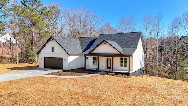 modern farmhouse style home with a garage and covered porch