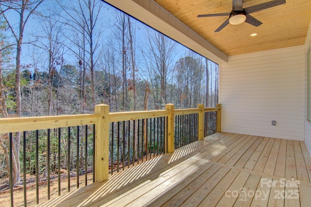 wooden terrace with a ceiling fan