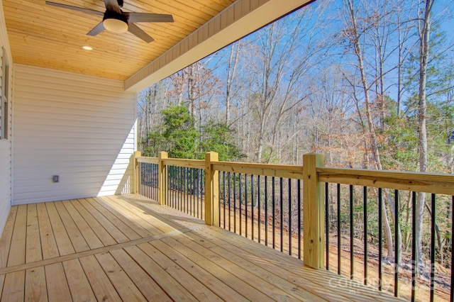 wooden deck with a ceiling fan