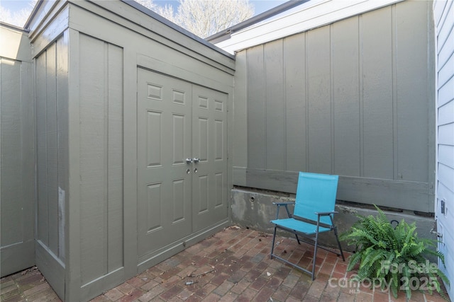 entrance to property with a patio area and board and batten siding