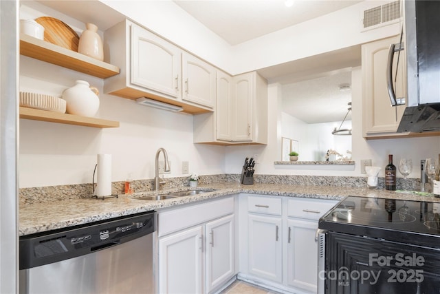 kitchen featuring open shelves, visible vents, appliances with stainless steel finishes, white cabinetry, and a sink