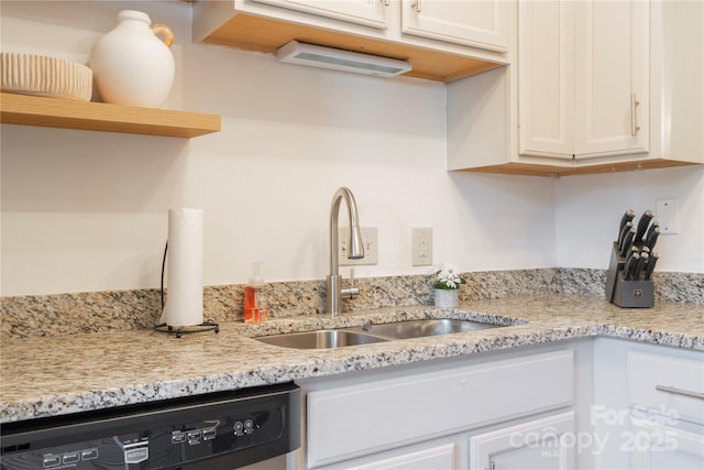 kitchen with white cabinets, a sink, dishwasher, and open shelves