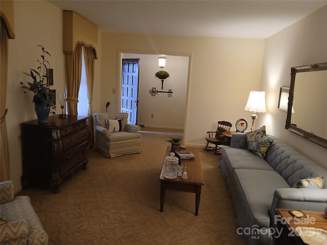 living room featuring baseboards and carpet