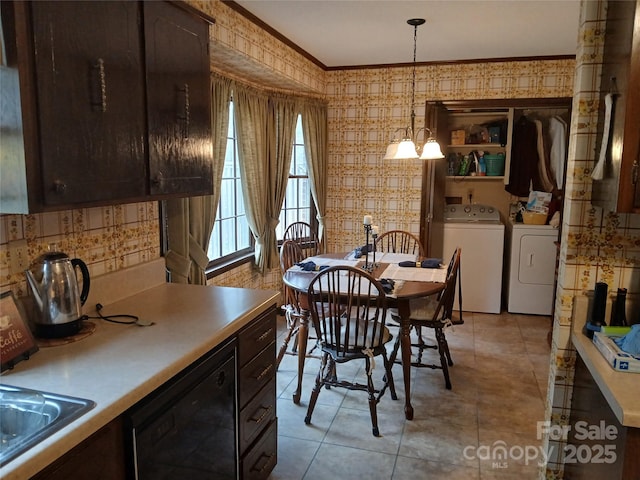 dining area featuring washer and dryer, crown molding, and wallpapered walls