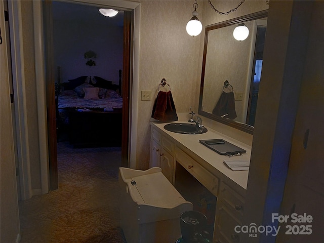 bathroom with vanity and connected bathroom