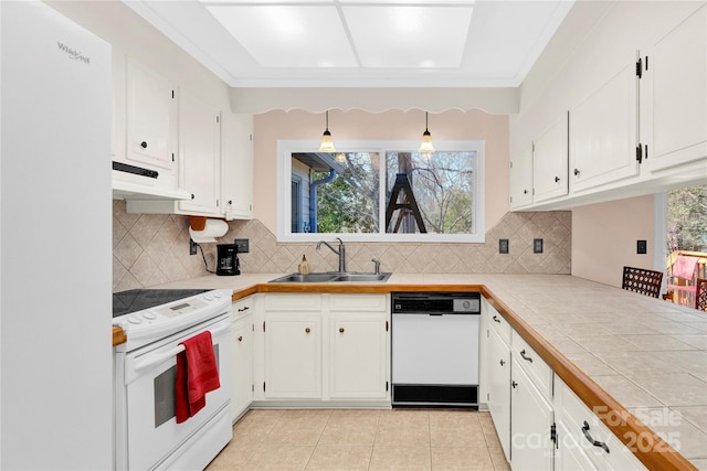 kitchen with white cabinetry, a sink, light tile patterned flooring, white appliances, and under cabinet range hood