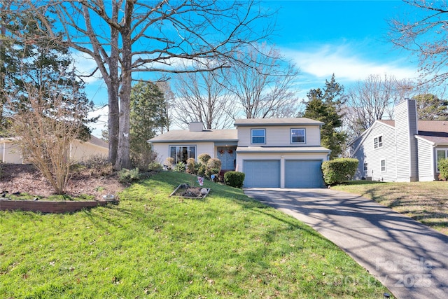 view of front facade with a garage, a front yard, and driveway