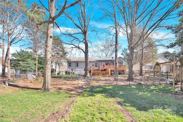 view of yard featuring stairway, a fenced backyard, and a deck