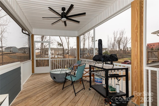 wooden deck featuring a ceiling fan