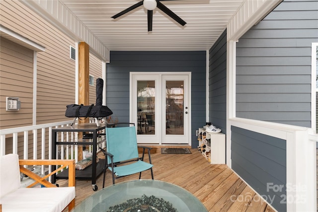 deck featuring a ceiling fan and outdoor dining area