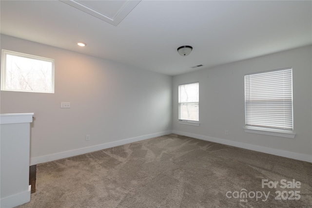 carpeted spare room featuring recessed lighting and baseboards