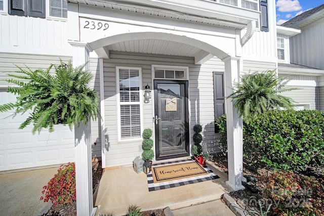 property entrance with a garage