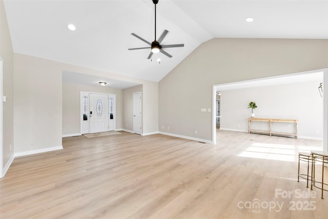 unfurnished living room featuring baseboards, ceiling fan, vaulted ceiling, recessed lighting, and light wood-style floors