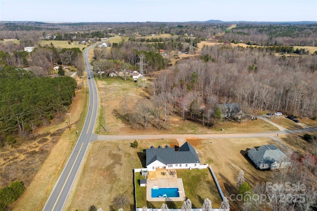 birds eye view of property featuring a rural view