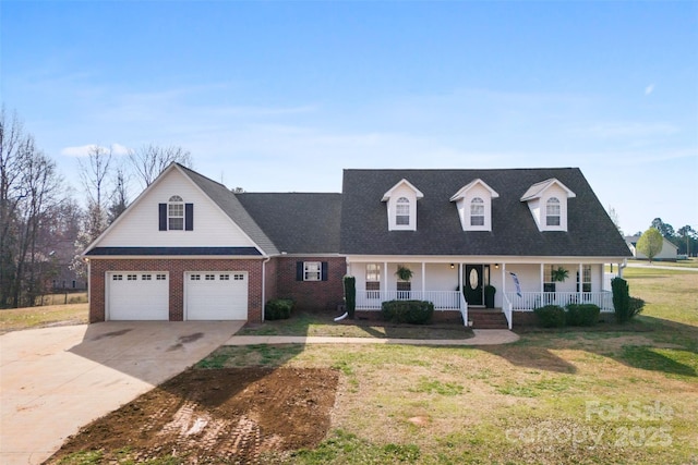 cape cod house featuring brick siding, a front yard, a porch, and driveway