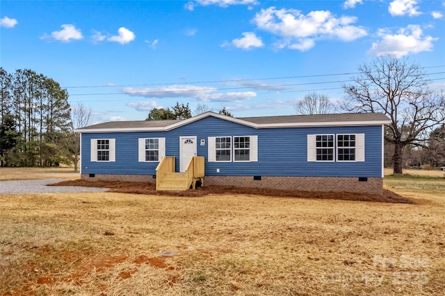 view of front of property with a front yard and crawl space