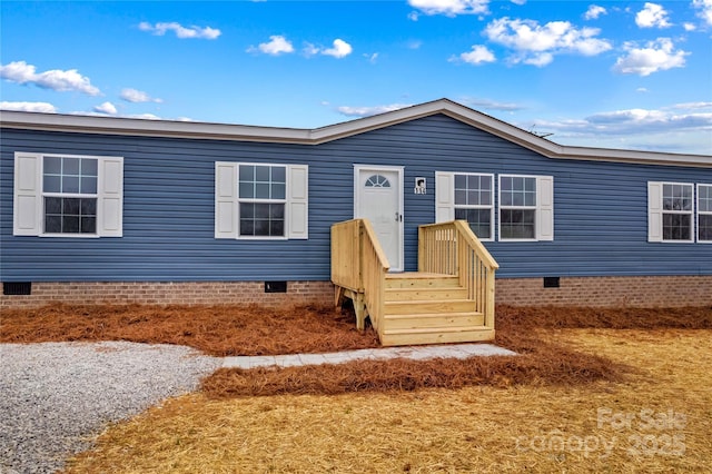 view of front of home with crawl space