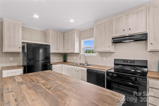 kitchen featuring recessed lighting, under cabinet range hood, butcher block countertops, a sink, and black appliances