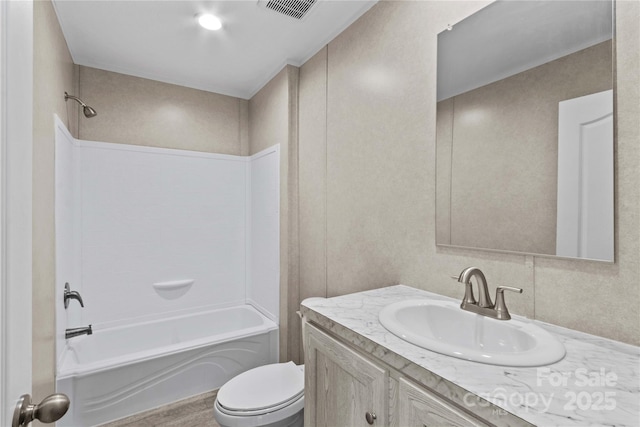 full bathroom featuring toilet, washtub / shower combination, visible vents, and vanity