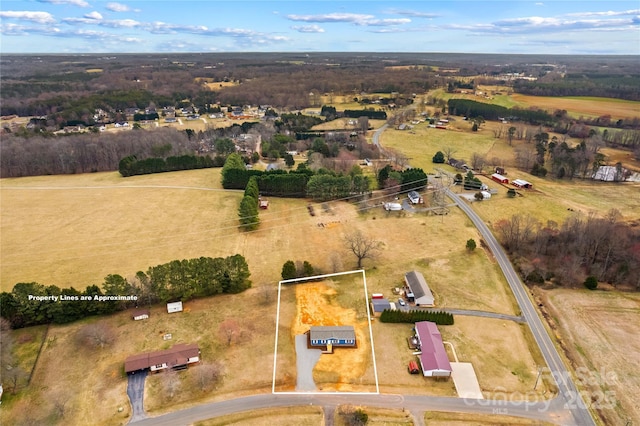 birds eye view of property featuring a rural view