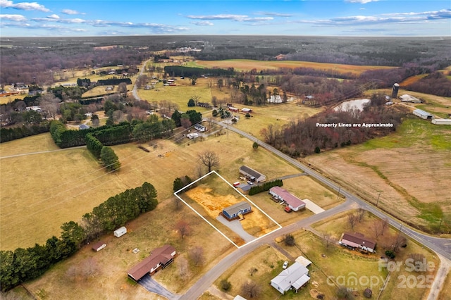 birds eye view of property featuring a rural view