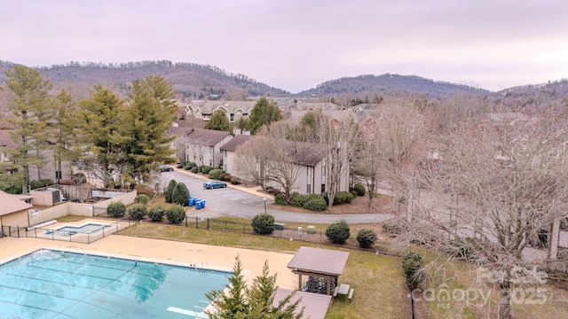 birds eye view of property with a mountain view