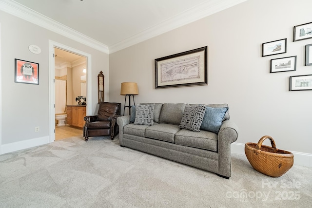 carpeted living area featuring baseboards and ornamental molding