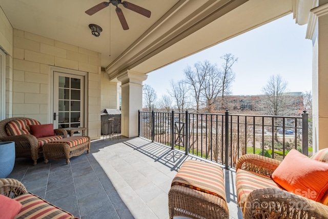 balcony with a ceiling fan and a sunroom